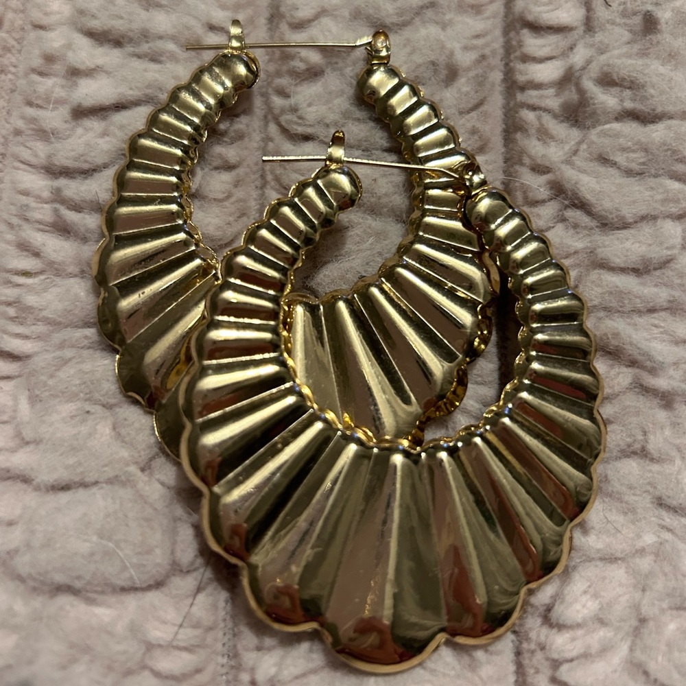 Set of three earrings- gold bangle hoop, black and gold hoop, and silver circles